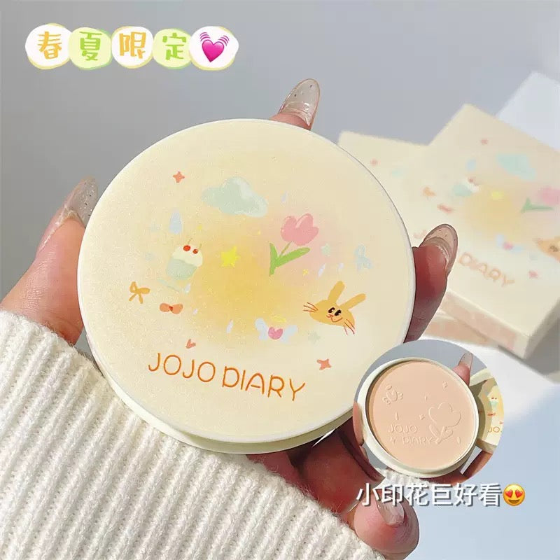 A Jojo diary cake compact with puff