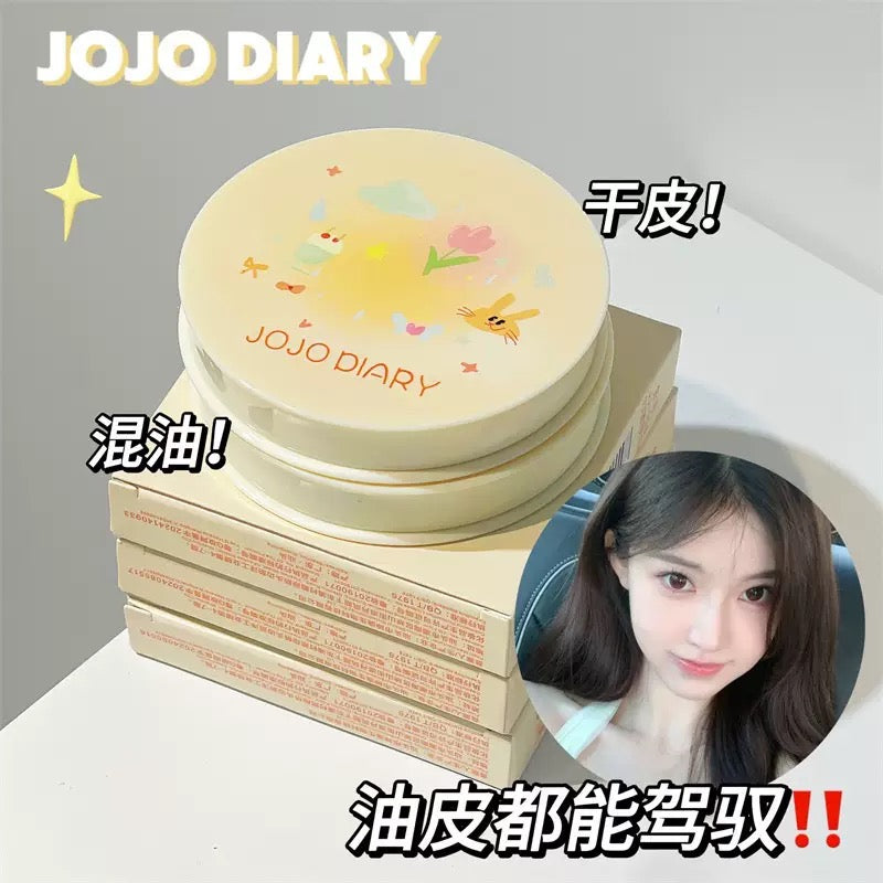 A Jojo diary cake compact with puff